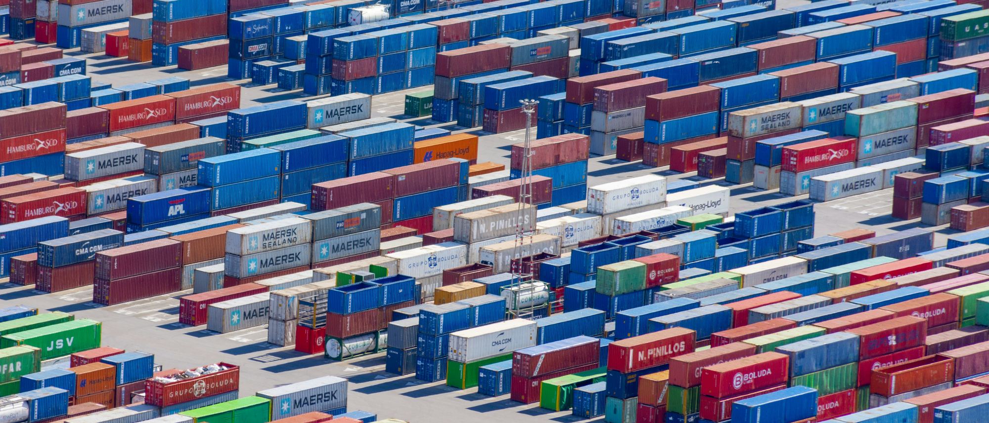 Stacked shipping containers in a terminal yard