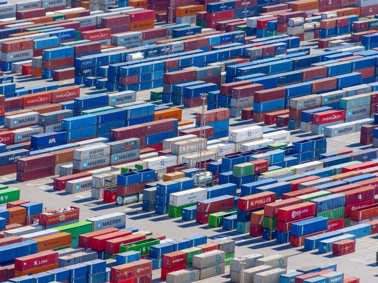 Stacked shipping containers in a terminal yard