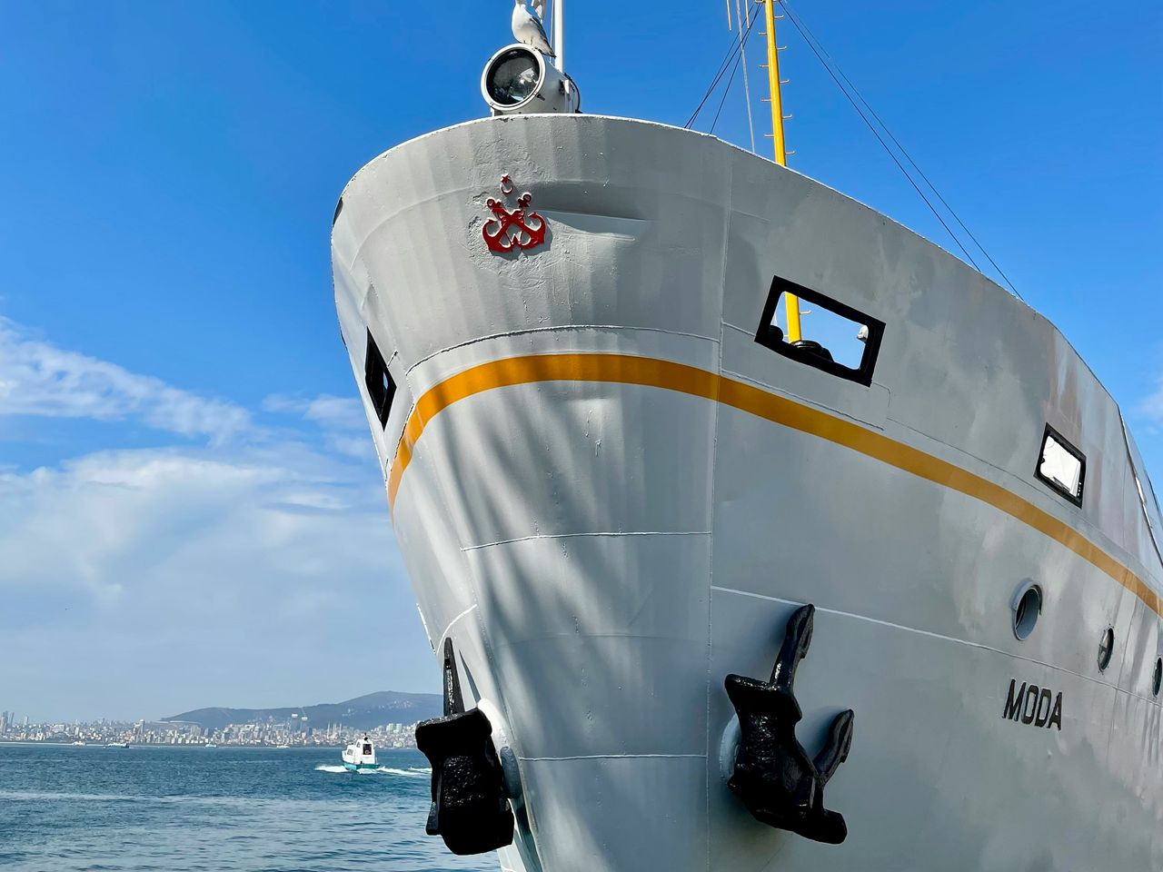 The bow of a ship in Istanbul, with the city on the horizon